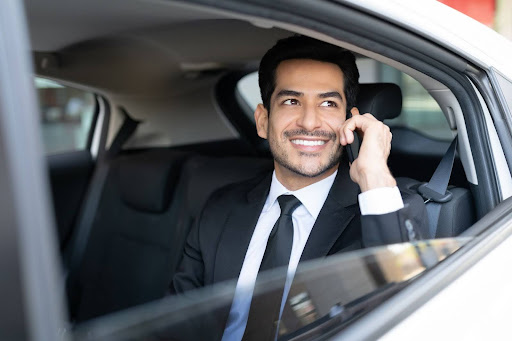 man on the phone in a taxi